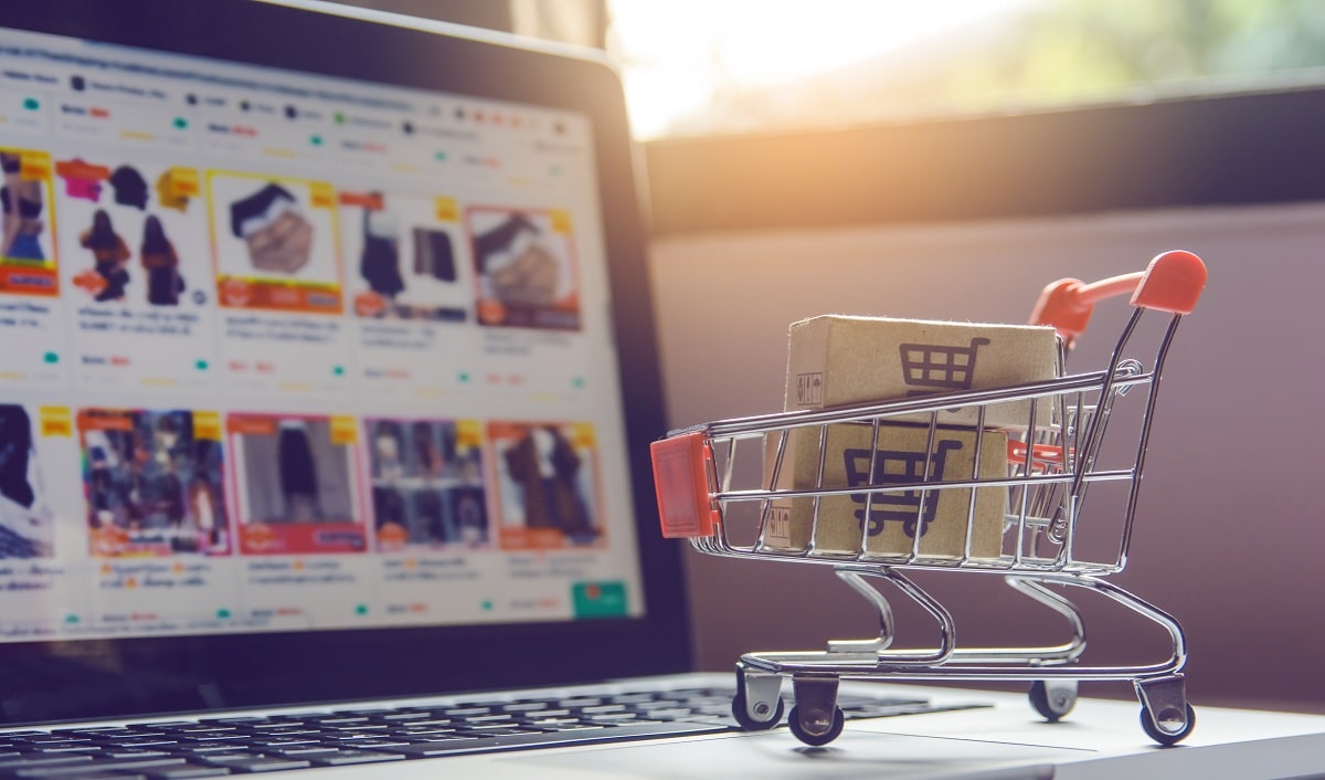 parcel-paper-cartons-with-shopping-cart-logo-trolley-laptop-keyboard-min